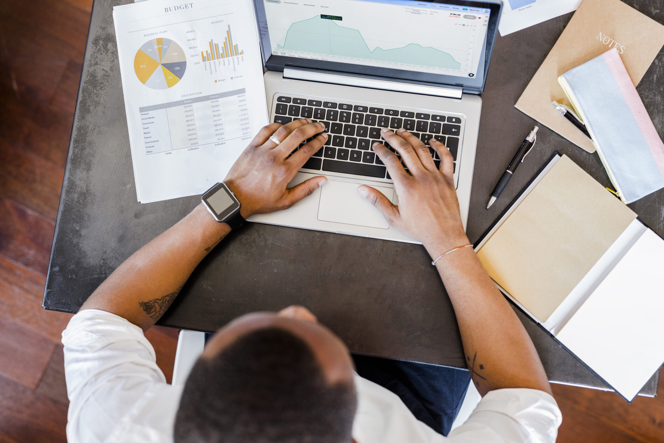 Man typing on computer doing trading on Clarity platform